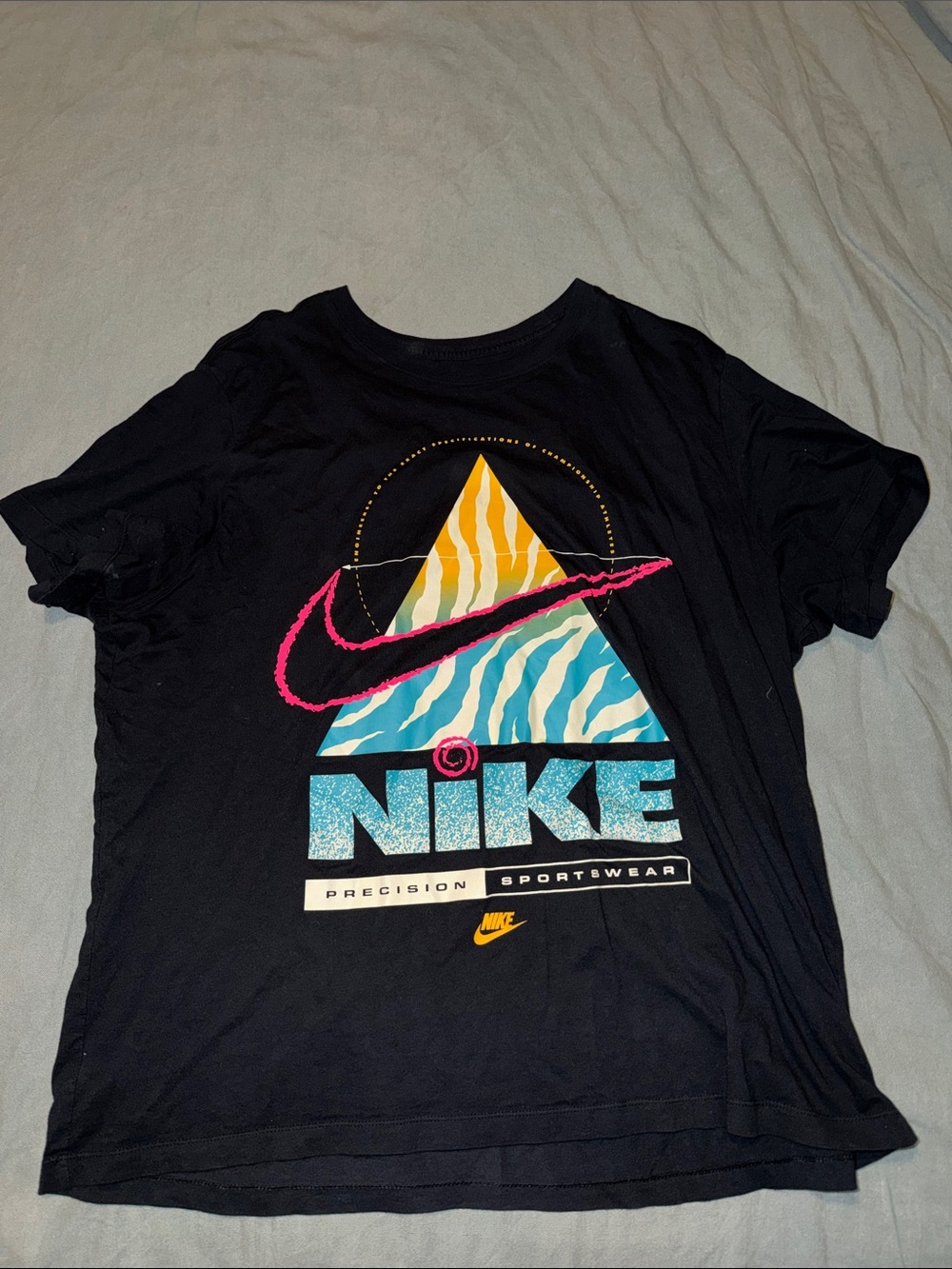 Nike Black Graphic Tee with Teal Triangle, Yellow Accent and Pink Swoosh